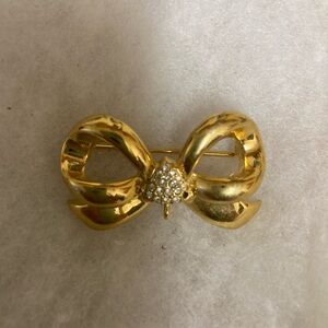 Gold tone brooch